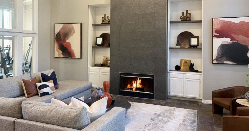 a living room with a fireplace and a couch